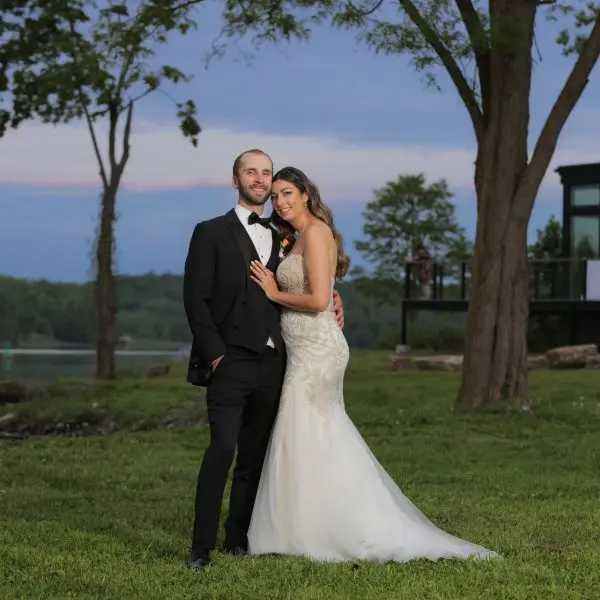 Bride and groom posing for photo