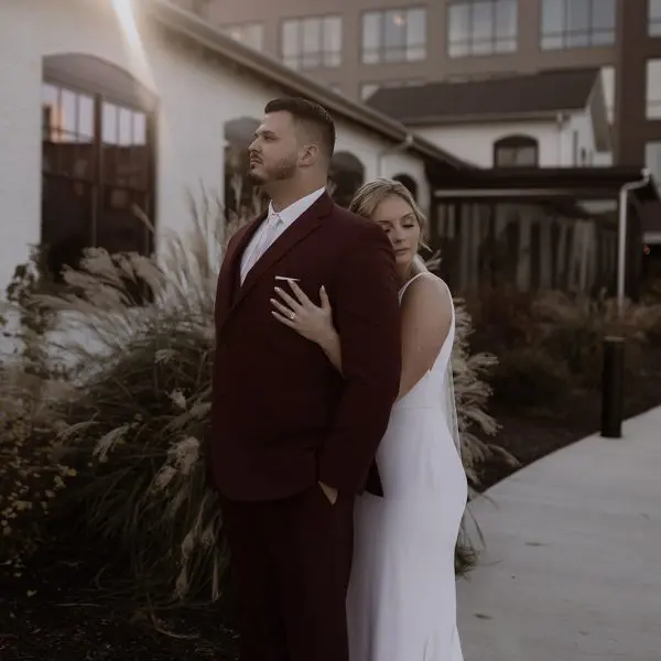 Bride hugs groom